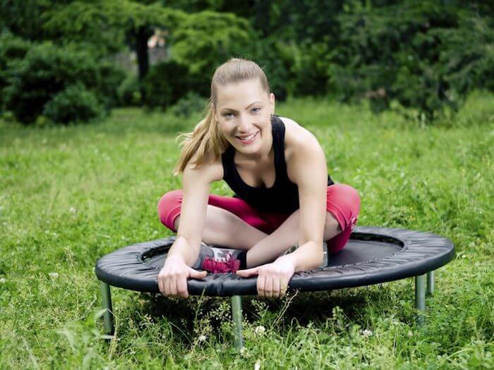 women-stretching-on-rebounder-benefits-of-rebounding.jpg